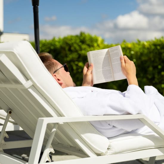 Reader on a sunlounger