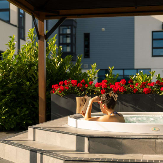 hot tub and red flowers