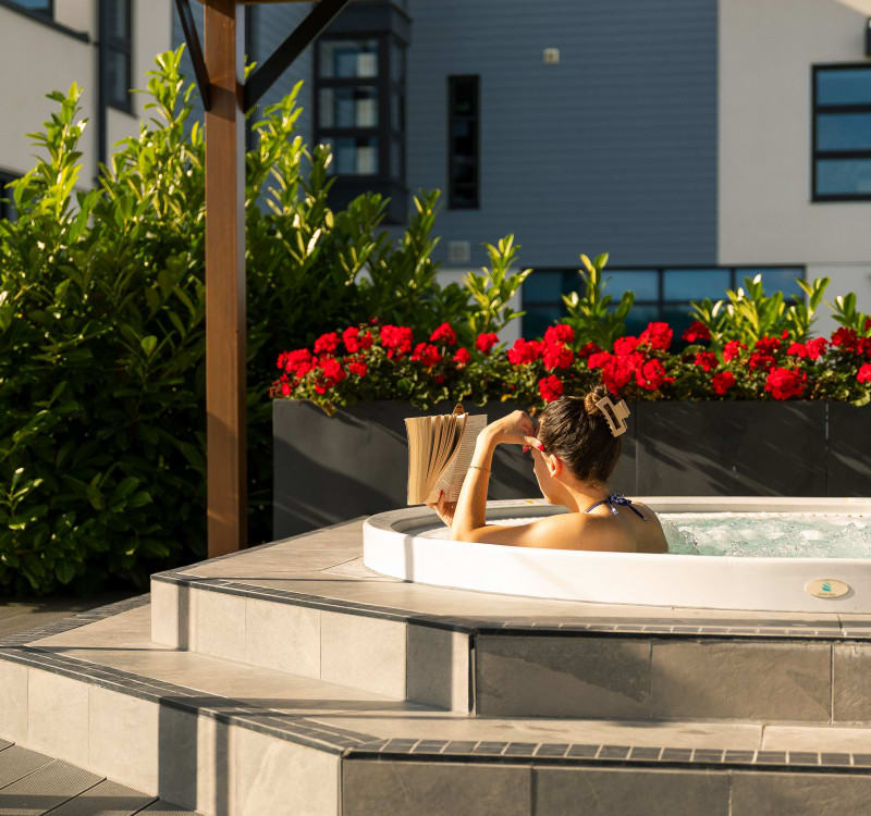 hot tub and red flowers