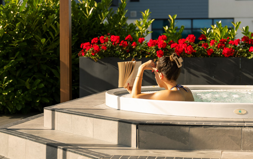 hot tub and red flowers