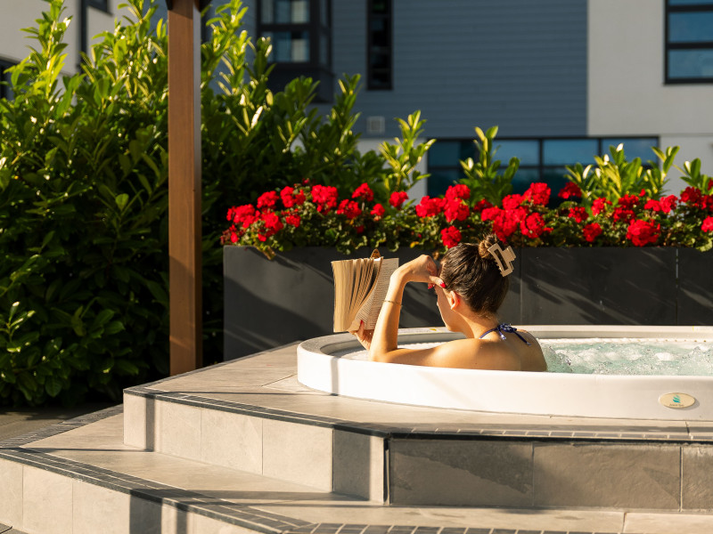hot tub and red flowers