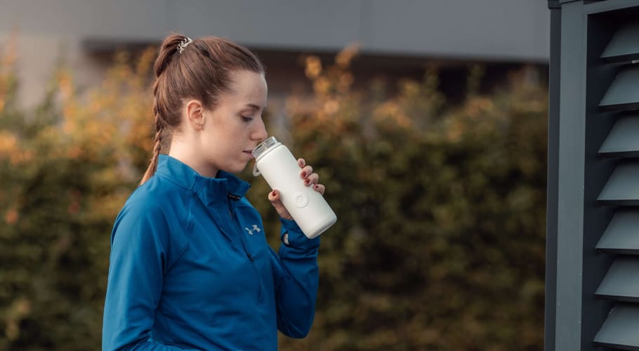 water drinking from water bottle